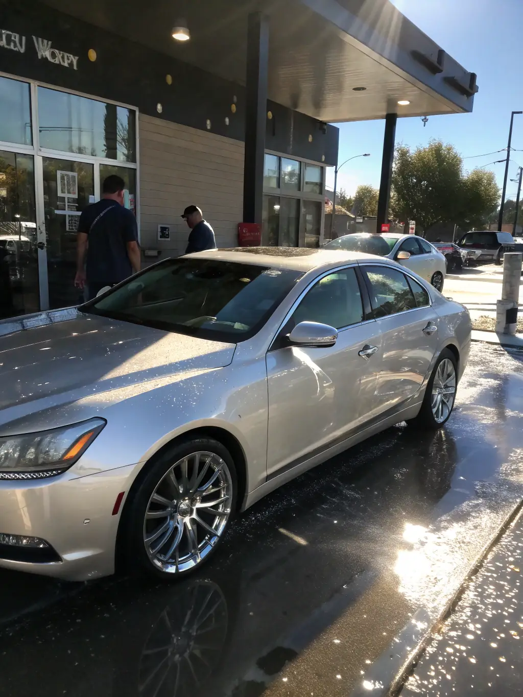 A gleaming car exterior after a wash and wax, highlighting the shine and protection provided by Koc20Detailing's exterior wash service, with water beading on the surface.